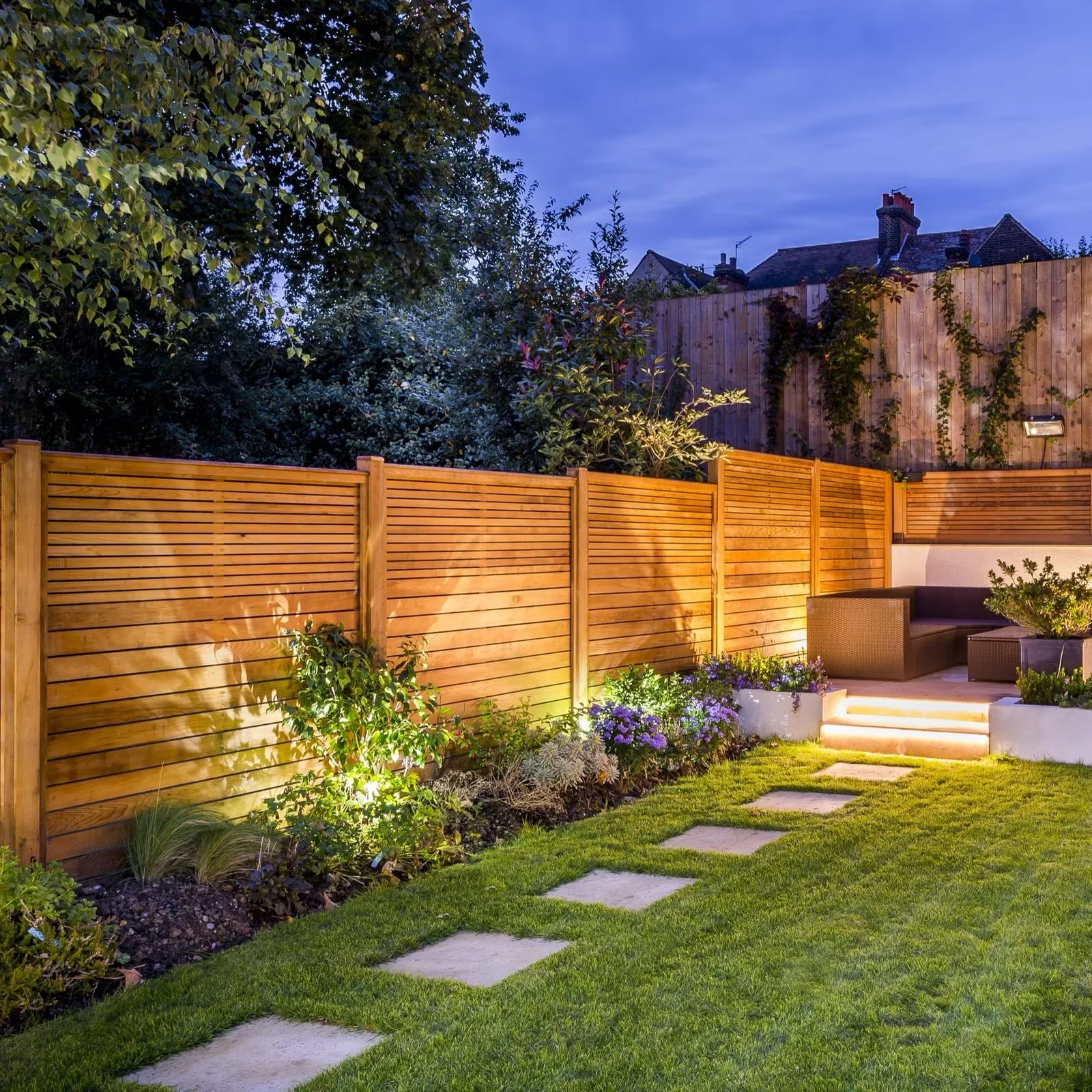 Cedar privacy fence with landscape lighting